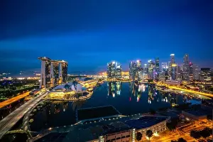 Panorama of Singapore business district skyline and office skyscraper at night in Marina bay, Singapore. Asian tourism, modern city life, or business