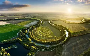 Longest Prints: Panorama of Small Danube river from drone at sunset with gren fields and sun, Slovakia