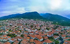 Olympus Prints: Panorama of Small Greek quiet resort town of Litochoro with small houses with red tiled roofs