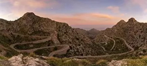 Snake Road Prints: panorama sunrise landscape in the Tramuntana mountains of Mallorca with a view of the landmark snake road leading down