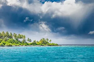 Panorama of tropical island with coconut palm trees on sandy beach. Maldives, Indian Ocean