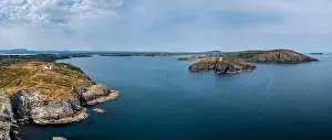 A panorama view of the entrance to the Baltimore Harbor in West Cork with teh Sherkin Island Lighthouse