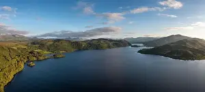 Ring Of Kerry Prints: A panorama view of Lough Caragh lake in the Glencar Valley of Kerry County in warm eveing light