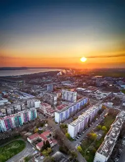 Circle City Prints: Panorama view of the road with a circular motion and a flower bed at sunset
