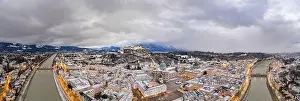 Salzach Prints: Panoramic aerial drone overview of Salzburg old town skyline covered with snow