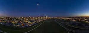 Panoramic aerial drone picture of Dallas skyline and Trammel Crow Park at sunset