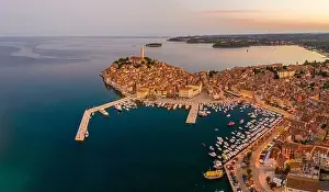 Panoramic aerial drone picture of the historic city Rovinj and harbor in Croatia during sunrise in summer