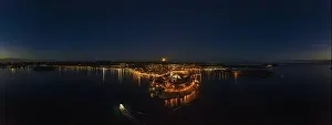Panoramic aerial drone picture of the historic city Rovinj and harbor with full moon in Croatia during sunset in summer