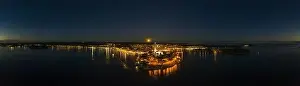 Panoramic aerial drone picture of the historic city Rovinj and harbor with full moon in Croatia during sunset in summer