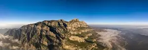 Conglomerate Prints: Panoramic aerial drone shot of Abbey Montserrat near Barcelona in mountain range in morning