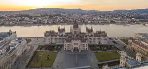 Kossuth Square Prints: Panoramic aerial drone shot of Hungarian Parliament by Danube river in Kossuth Square in Budapest sunset