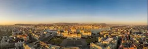 Panoramic aerial drone shot of Hungarian Parliament lights off before sunrise in Budapest dawn