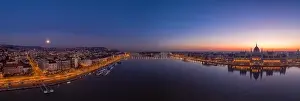 Morning Glow Prints: Panoramic aerial drone shot of Hungarian Parliament lights off sunrise in Budapest dawn