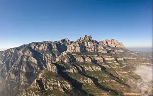 Conglomerate Prints: Panoramic aerial drone shot of Montserrat mountain range near Barcelona in winter morning