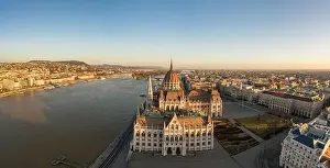Morning Glow Prints: Panoramic aerial drone shot of south side facade of Hungarian Parliament during Budapest sunrise