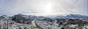 Panoramic aerial drone shot view of snoy Salzburg in winter morning