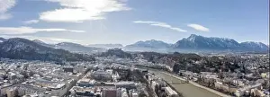 Salzach Prints: Panoramic aerial drone view of Salzburg snowy old town of Hohensalzburg fortress Unesberg mountain in winter morning