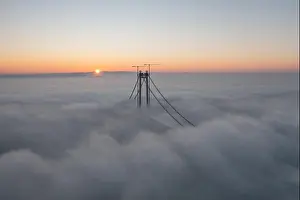 Panoramic aerial drone view from above of the suspended bridge over danube river, under construction, between Braila and Tulcea cities in Romania