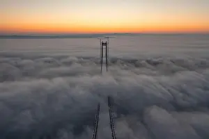 Panoramic aerial drone view from above of the suspended bridge over danube river, under construction, between Braila and Tulcea cities in Romania