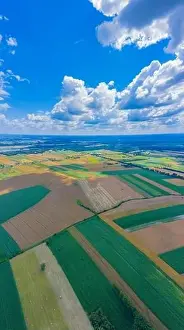 Grass And Sky Prints: Panoramic Aerial vast green field view - Agriculture field aerial photo - Green landscapes drone photo