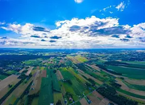 Grass And Sky Prints: Panoramic Aerial vast green field view - Agriculture field aerial photo - Green landscapes drone photo