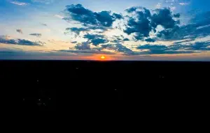 Lamphun Prints: Panoramic aerial view of beautiful green tropical forest with mountains and majestic blue sky and clouds