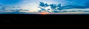 Lamphun Prints: Panoramic aerial view of beautiful green tropical forest with mountains and majestic blue sky and clouds