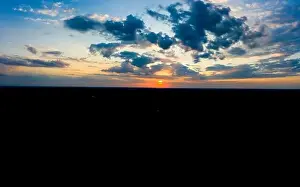 Lamphun Prints: Panoramic aerial view of beautiful green tropical forest with mountains and majestic blue sky and clouds