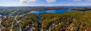 Panoramic aerial view of Lake Waukewan in fall from town center of Meredith, New Hampshire NH, USA