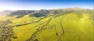 Armenia Prints: Panoramic aerial view of lush green fields and village houses