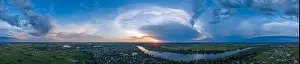 Water Country Prints: Panoramic aerial view of the nature landscape with green meadows and a river at sunset