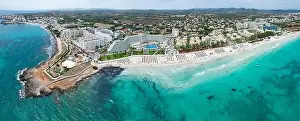 Beach Umbrellas Prints: Panoramic aerial view of Sa Coma beach in Mallorca Spain on a summer day