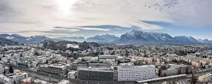 Salzach Prints: Panoramic aerial view of Salzburg outskirts railway station with view of snowy untersberg and old town