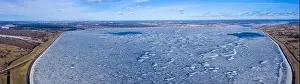 Panoramic aerial view of the winter dam near hydroelectric power plant