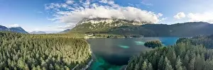 Garmisch Prints: Panoramic aerial view of Zugspitze mountain heavy fog by Eibsee Lake in Germany