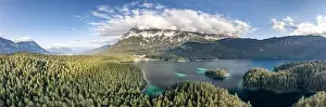 Garmisch Prints: Panoramic aerial view of Zugspitze mountain heavy fog by Eibsee Lake in Germany
