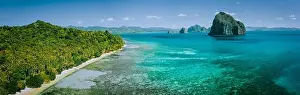 Sandy Bottom Prints: Panoramic drone aerial view of coastal scenery from the mainland Palawan with tropical Pinagbuyutan islands on horizon