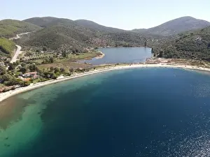 Surfers Prints: Panoramic drone photo of the tropical beach in the bay of Toroni in Halkidiki, Greece