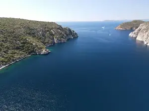 Surfers Prints: Panoramic drone photo of the tropical beach in the bay of Toroni in Halkidiki, Greece