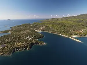 Surfers Prints: Panoramic drone photo of the tropical beach in the bay of Toroni in Halkidiki, Greece