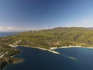 Surfers Prints: Panoramic drone photo of the tropical beach in the bay of Toroni in Halkidiki, Greece