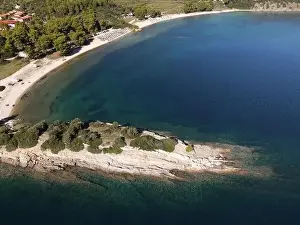 Surfers Prints: Panoramic drone photo of the tropical beach in the bay of Toroni in Halkidiki, Greece