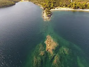 Surfers Prints: Panoramic drone photo of the tropical beach in the bay of Toroni in Halkidiki, Greece