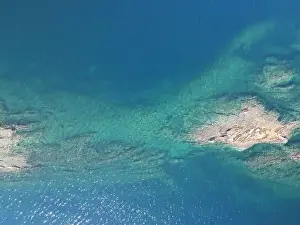 Surfers Prints: Panoramic drone photo of the tropical beach in the bay of Toroni in Halkidiki, Greece