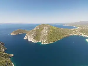 Surfers Prints: Panoramic drone photo of the tropical beach in the bay of Toroni in Halkidiki, Greece