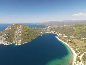 Surfers Prints: Panoramic drone photo of the tropical beach in the bay of Toroni in Halkidiki, Greece