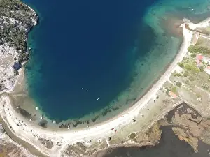 Surfers Prints: Panoramic drone photo of the tropical beach in the bay of Toroni in Halkidiki, Greece