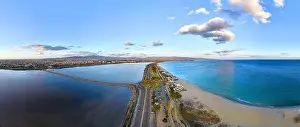 Wetlands Prints: Panoramic drone photo of Viale Lungomare del Golfo in Cagliari during the golden hour