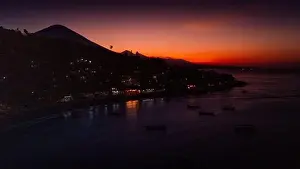 Panoramic drone view of coastline with volcano on twilight in Bali