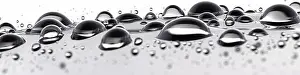 Tear Prints: Panoramic image of water drops ion a white background